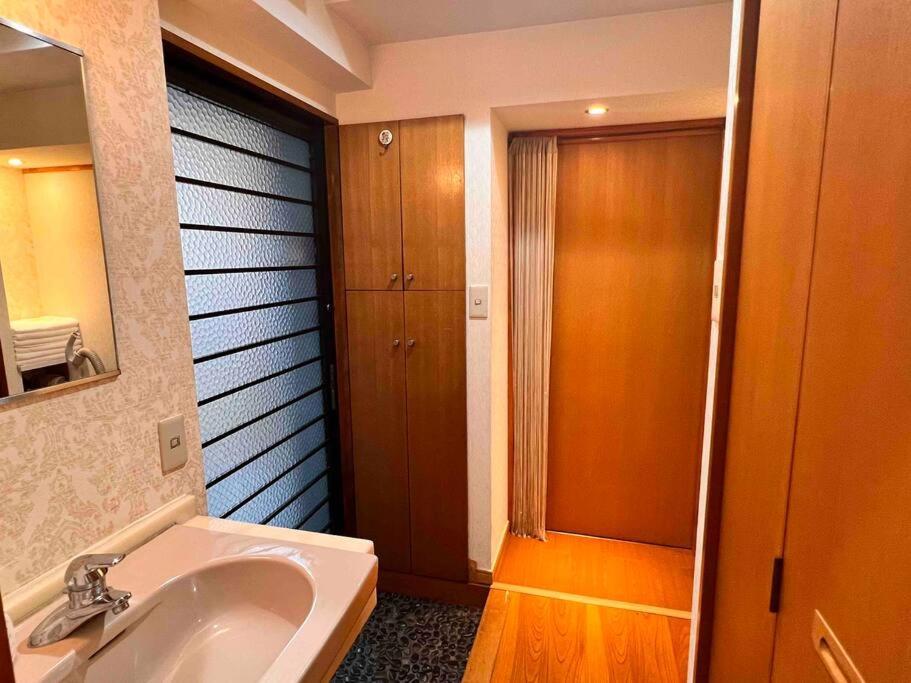 7th Floor Apartment: Airport-accessible Urban Retreat *
